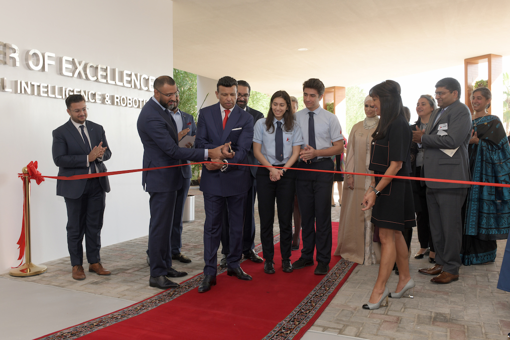 Mr Sunny and Mr Dino Varkey cutting the ribbon